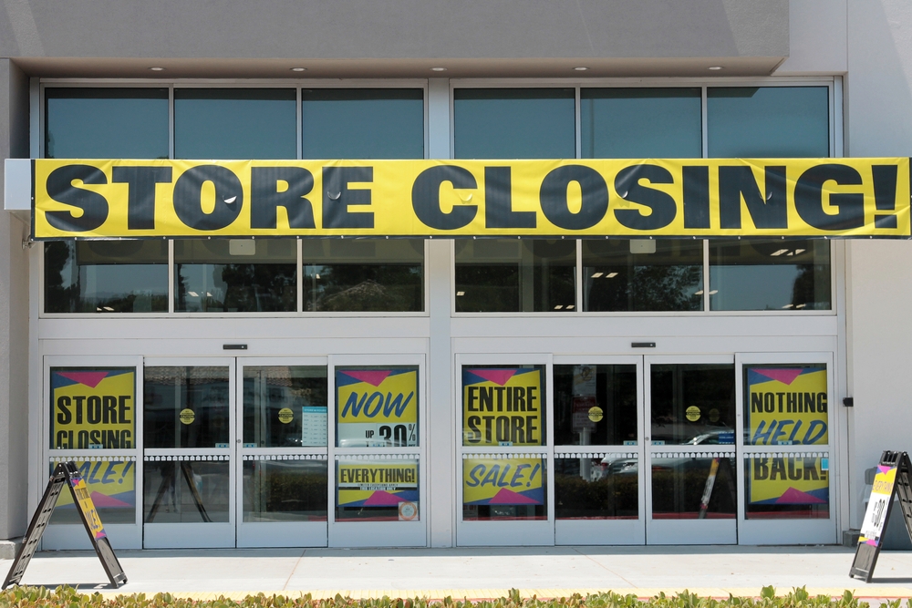 Retail store displaying a “Store Closing” banner, symbolizing small business bankruptcy and financial restructuring.