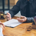 Business owner meeting with a lawyer to review legal documents and contracts